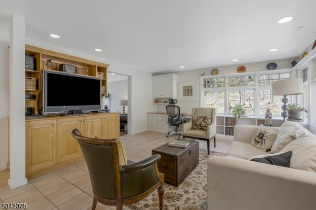 living room with light tile patterned flooring, baseboards, and recessed lighting
