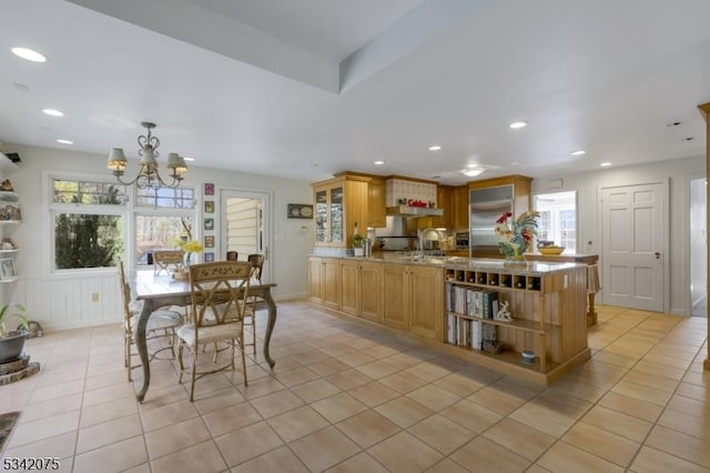 dining space with recessed lighting, a chandelier, and light tile patterned floors
