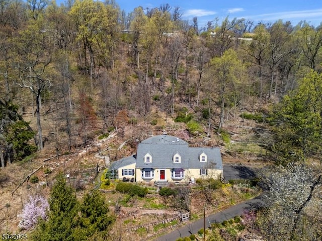 drone / aerial view with a view of trees