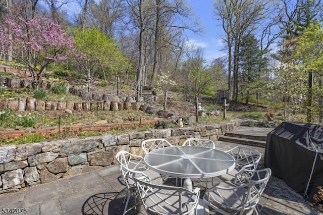 view of patio featuring outdoor dining area