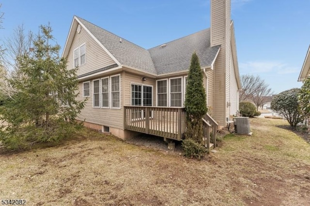 back of property featuring a deck, a shingled roof, a chimney, and central air condition unit