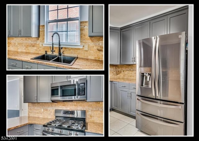 kitchen featuring appliances with stainless steel finishes, gray cabinets, light tile patterned flooring, and a sink