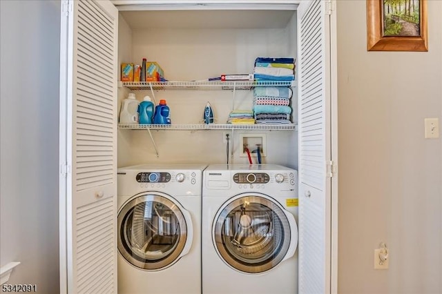 laundry area featuring laundry area and washing machine and dryer