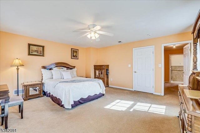 carpeted bedroom with visible vents, ceiling fan, and baseboards