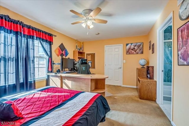 carpeted bedroom featuring a ceiling fan and baseboards