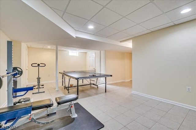 workout room featuring a paneled ceiling, baseboards, and recessed lighting