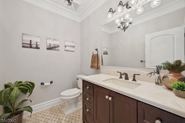 bathroom with toilet, ornamental molding, vanity, a chandelier, and baseboards