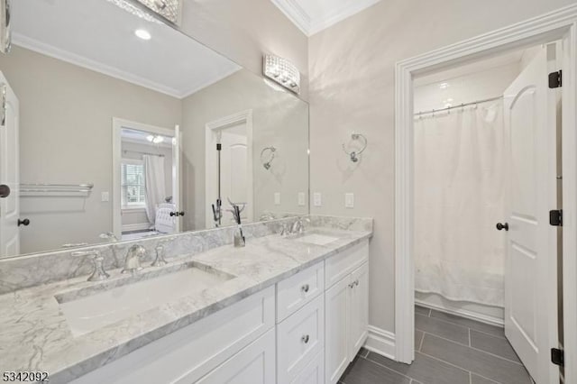 full bathroom featuring ornamental molding, tile patterned floors, a sink, and double vanity