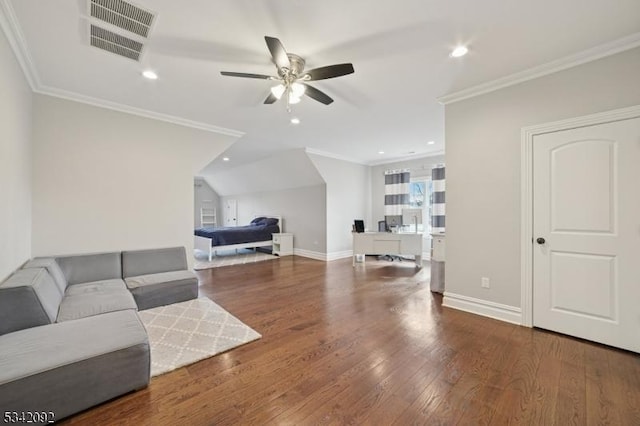 living room with ornamental molding, wood-type flooring, visible vents, and baseboards