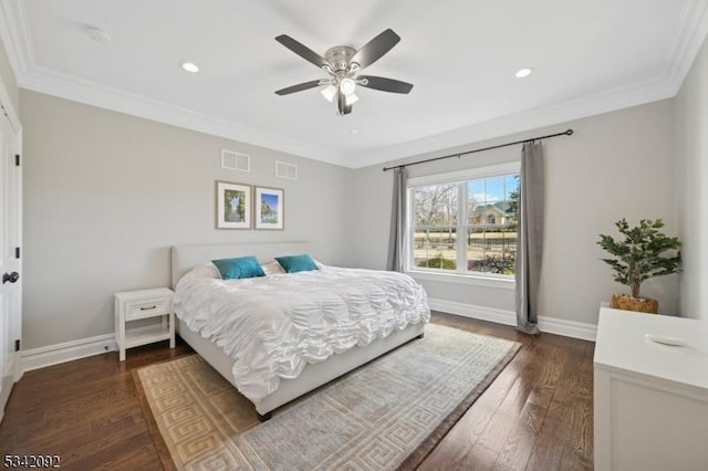 bedroom featuring dark wood-style floors, ornamental molding, and visible vents