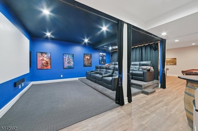 home theater room with recessed lighting, wood finished floors, and baseboards