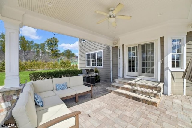 view of patio / terrace with ceiling fan, a grill, and an outdoor living space