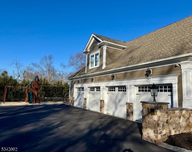 garage with aphalt driveway