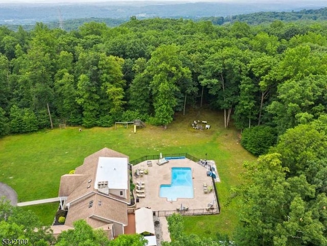 drone / aerial view with a view of trees