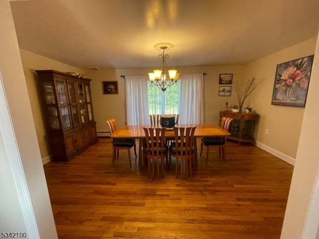 dining room featuring baseboards, a notable chandelier, baseboard heating, and wood finished floors