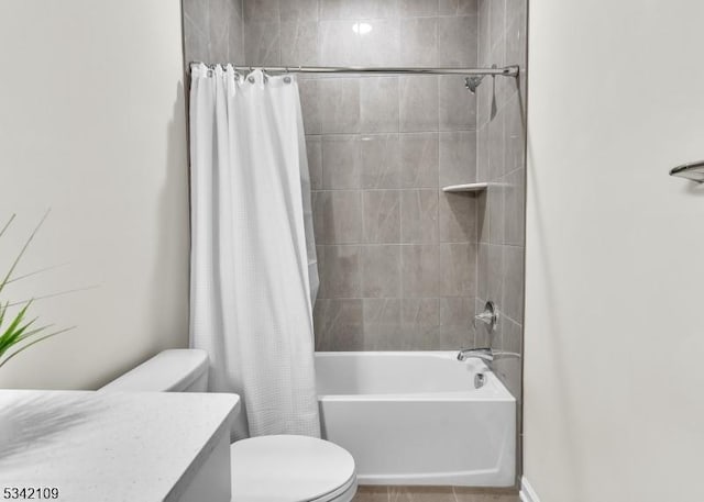 bathroom with shower / bath combo, vanity, and toilet