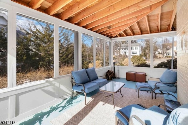 sunroom / solarium with vaulted ceiling