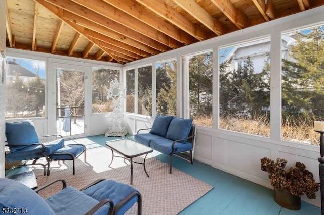 sunroom featuring a wealth of natural light and vaulted ceiling