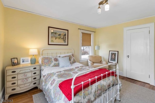 bedroom with wood finished floors