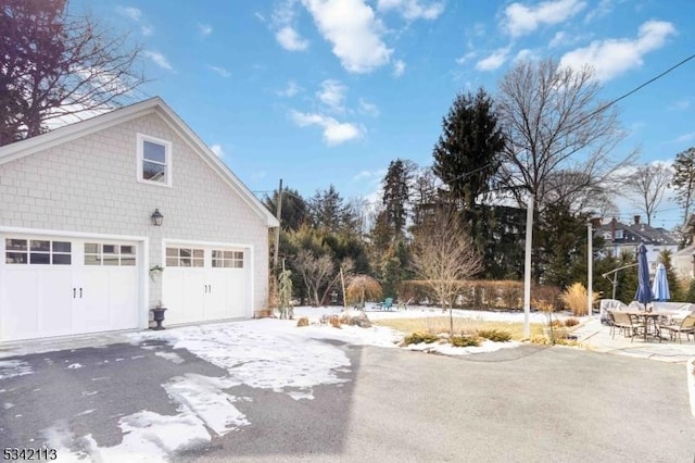 view of side of property featuring a garage