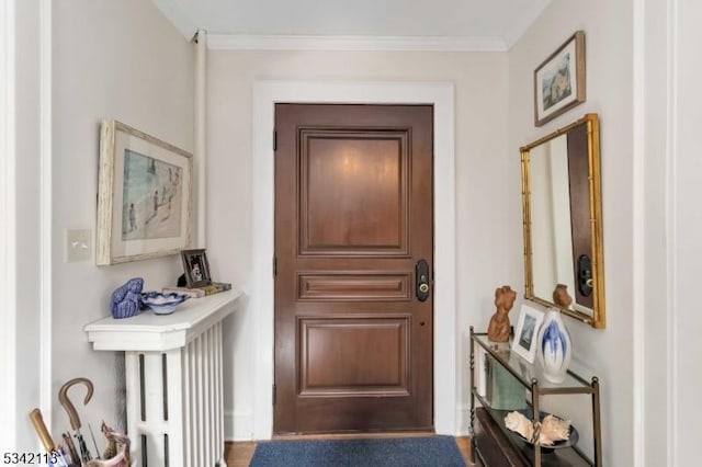 doorway to outside with ornamental molding