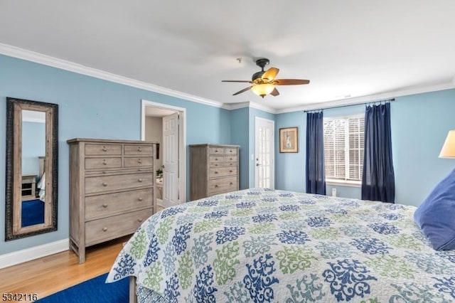 bedroom featuring light wood-style flooring, baseboards, crown molding, and a ceiling fan