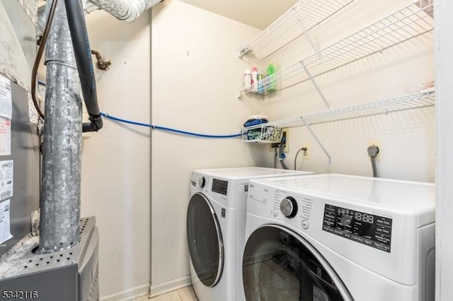 laundry area featuring independent washer and dryer and laundry area