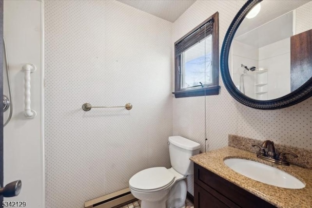 bathroom with a shower, baseboard heating, vanity, and toilet