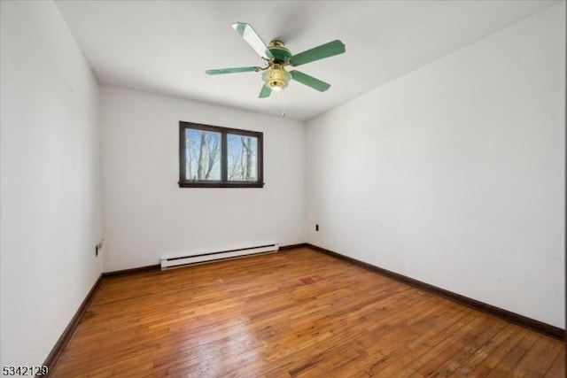 unfurnished room with light wood-style floors, a baseboard radiator, ceiling fan, and baseboards