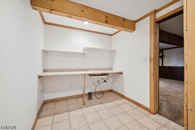 washroom featuring light tile patterned flooring, light carpet, and baseboards