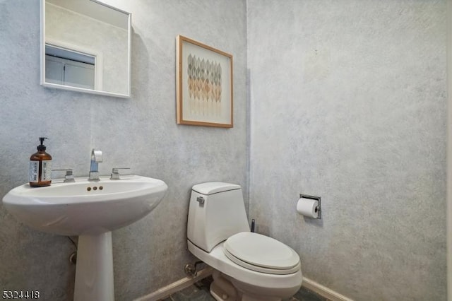 bathroom featuring toilet