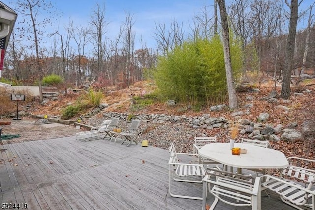deck featuring outdoor dining area