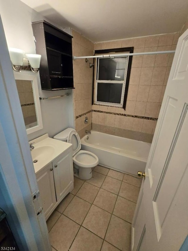 full bathroom with bathtub / shower combination, tile patterned floors, toilet, and vanity