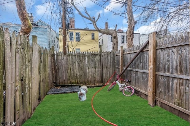 view of yard with a fenced backyard