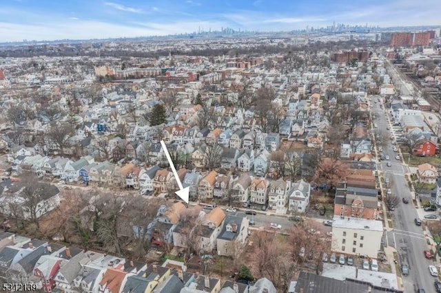 birds eye view of property with a residential view