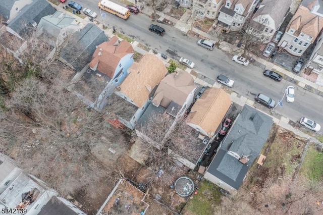 birds eye view of property with a residential view