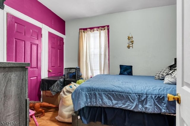 bedroom featuring wood finished floors