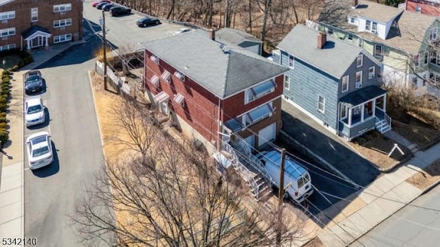 birds eye view of property with a residential view