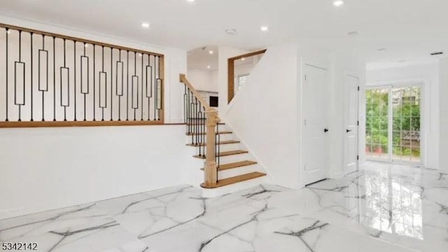 interior space featuring marble finish floor and recessed lighting