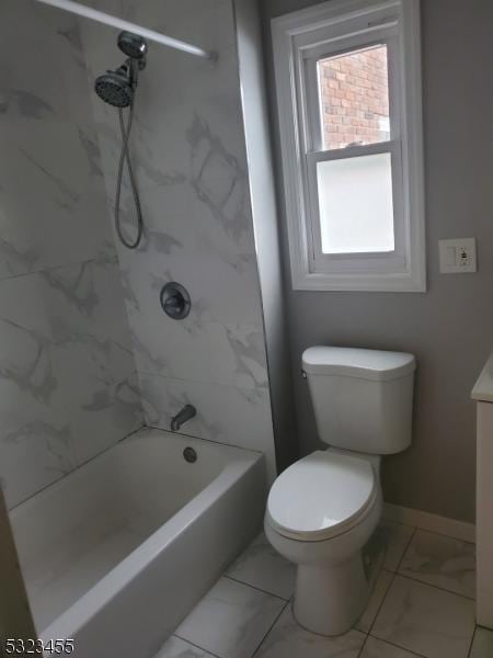 full bathroom featuring toilet, vanity, baseboards, marble finish floor, and  shower combination