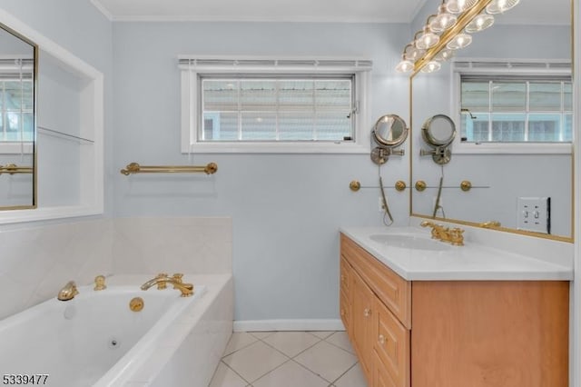 bathroom featuring baseboards, a jetted tub, tile patterned flooring, crown molding, and vanity