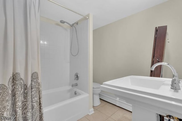 full bath with toilet, shower / tub combo, a sink, and tile patterned floors