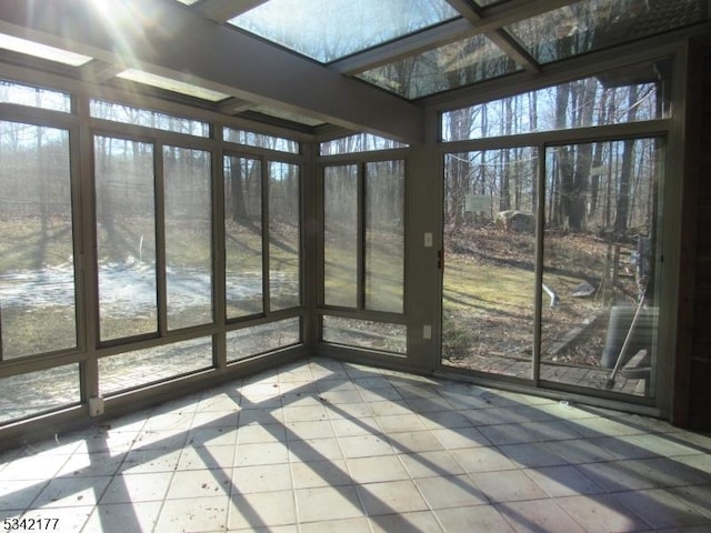 unfurnished sunroom featuring a healthy amount of sunlight