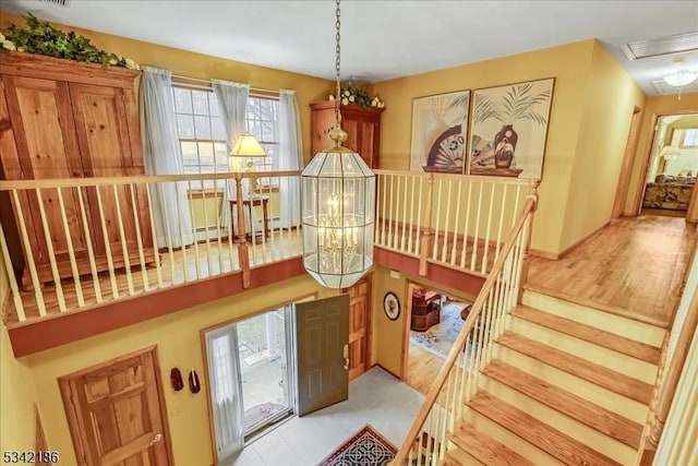 interior space with attic access, visible vents, and wood finished floors