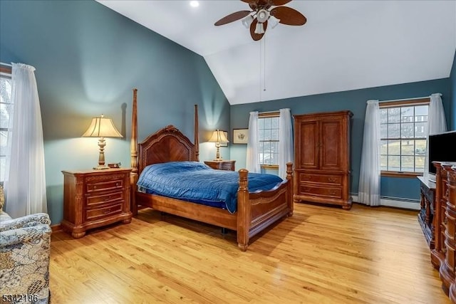 bedroom with light wood-style floors, lofted ceiling, multiple windows, and a ceiling fan