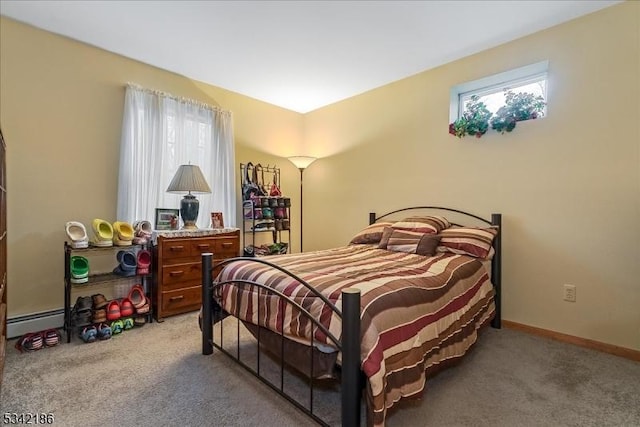 bedroom featuring light carpet, a baseboard radiator, and baseboards