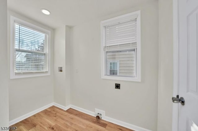 laundry room with washer hookup, light wood-style floors, electric dryer hookup, laundry area, and baseboards