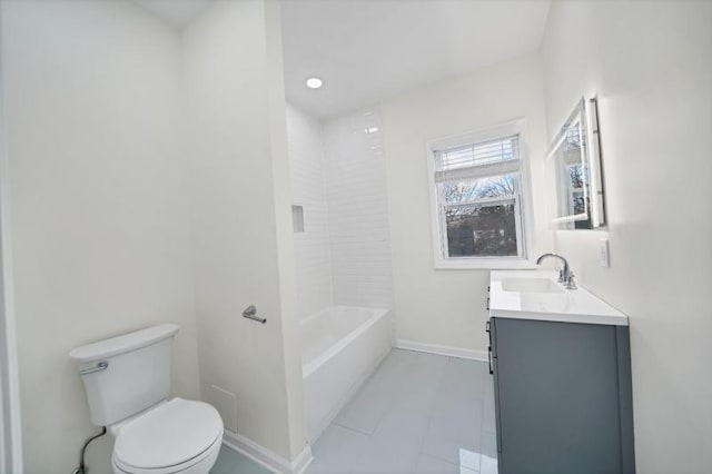 full bath featuring vanity, toilet, and baseboards