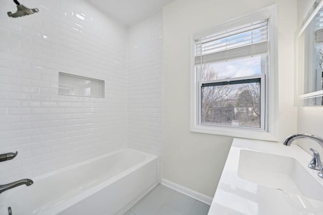 bathroom featuring tub / shower combination, tile patterned floors, vanity, and baseboards