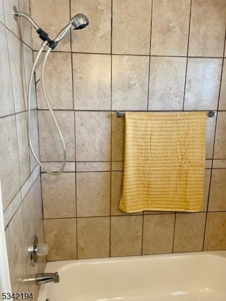 details featuring shower / bathing tub combination